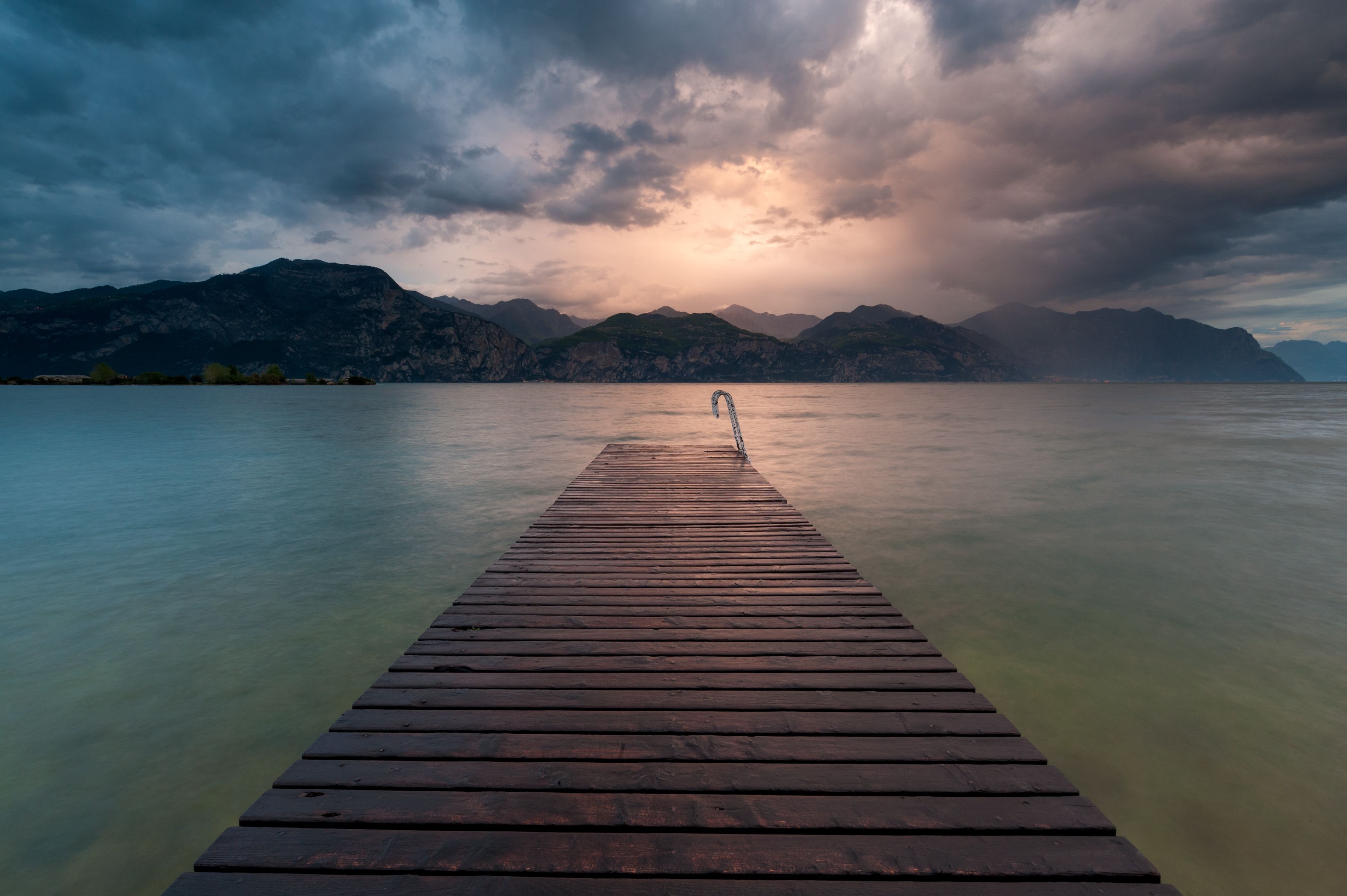 Wooden Dock Under Cloudy Sky · Free Stock Photo