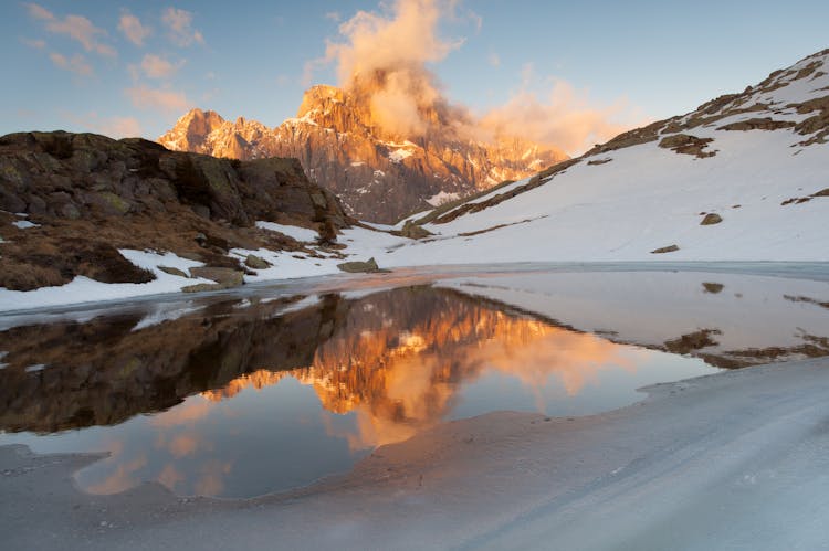 Beautiful Landscape Of Snowy Mountains At Sunset 