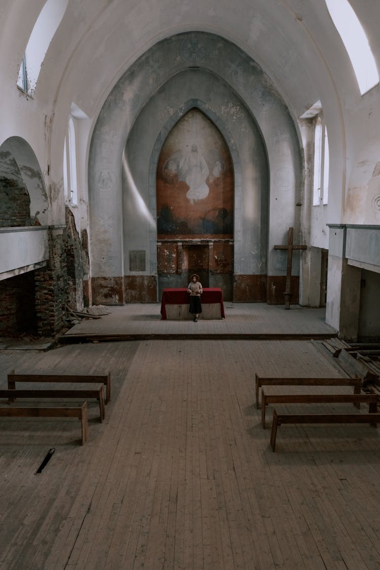 Drone Shot Of A Person At An Abandoned Lutheran Church