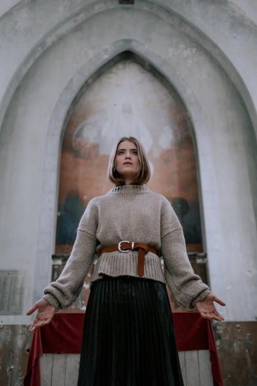Free A Woman Standing in an Abandoned Church Stock Photo