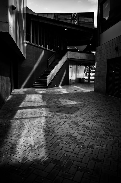 Free Black and white photo of a modern urban architecture with geometric shadows. Stock Photo