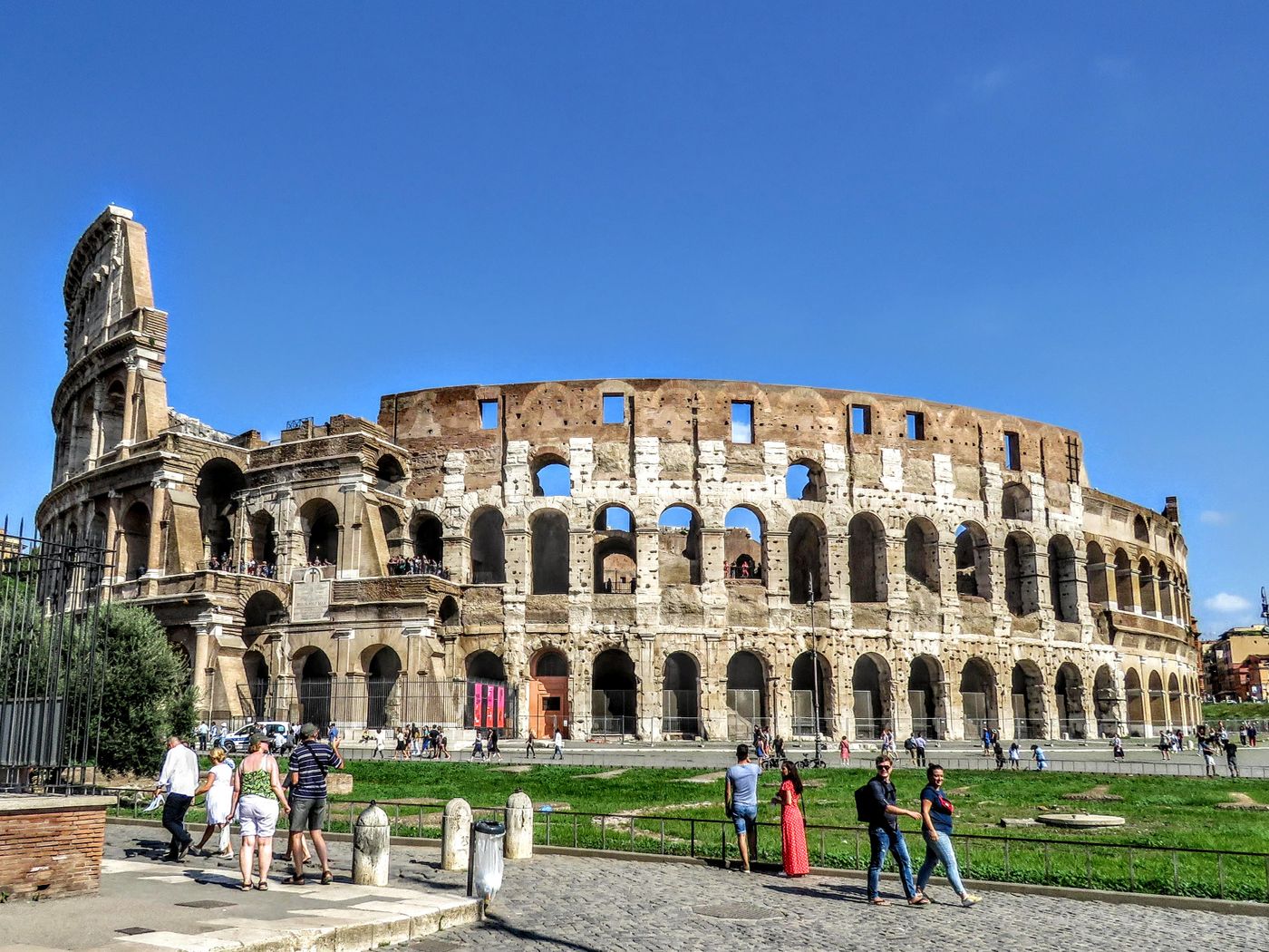 Tourists visiting the Colosseum in Rome