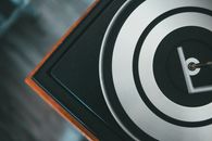 Top view of vintage record player with contrasting circles on platter with metal spindle in house
