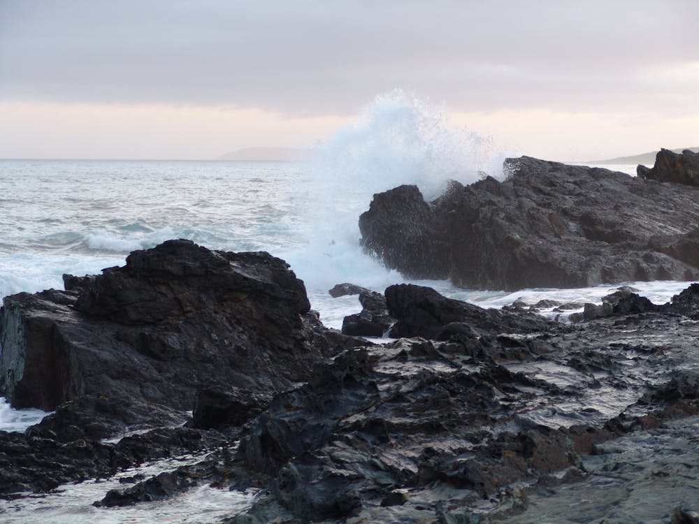 Free stock photo of rocks, sea beach, waves breaking Stock Photo