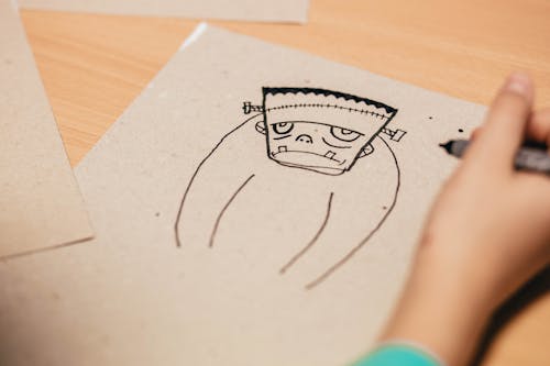 Free Kid Draws Cartoon Character Figure Stock Photo