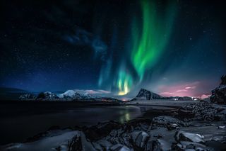 Green aurora over a night landscape — stein egil liland on Pexels
