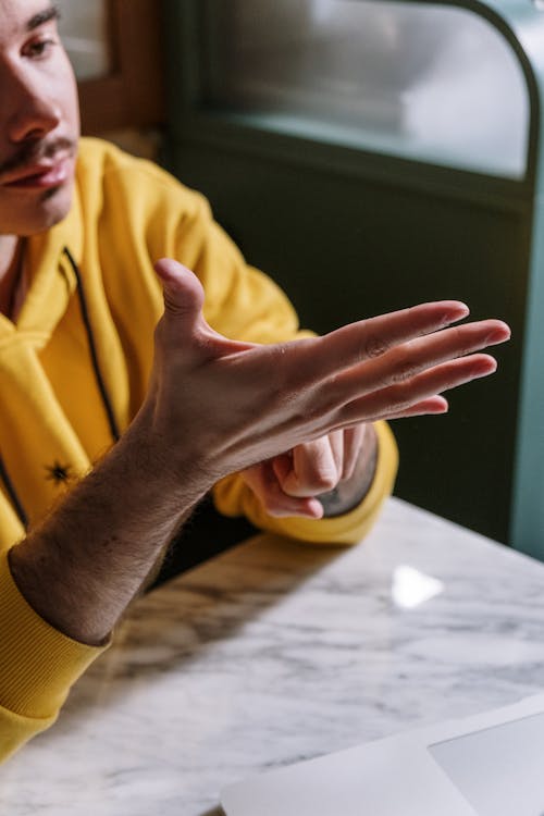 Free Photo of a Person Doing Sign Language Stock Photo