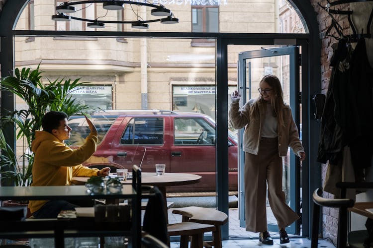 A Man And A Woman Meeting Up In A Restaurant