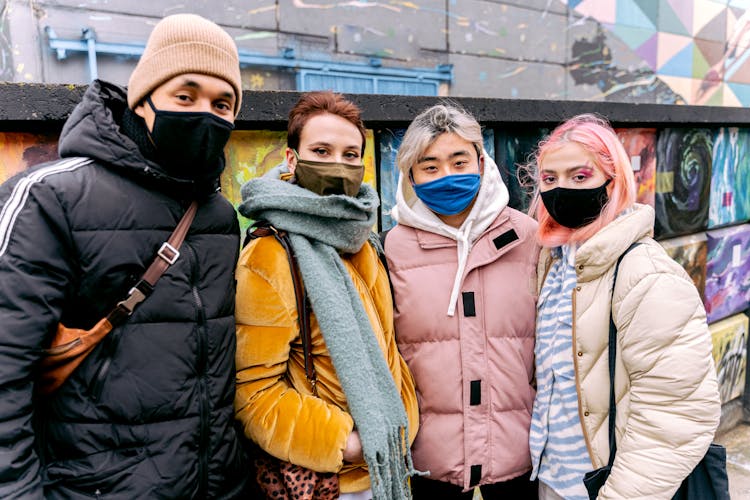 Group Of Young People In Winter Clothes And Protective Masks