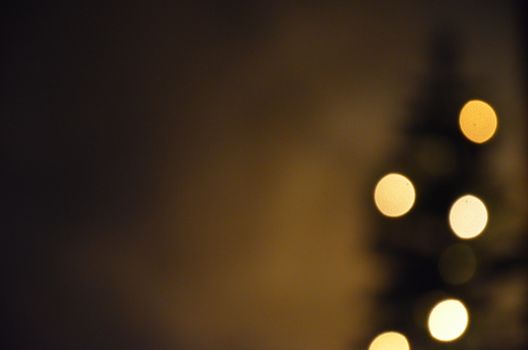 Blurred bokeh lights on a dark background creating an abstract artistic scene.