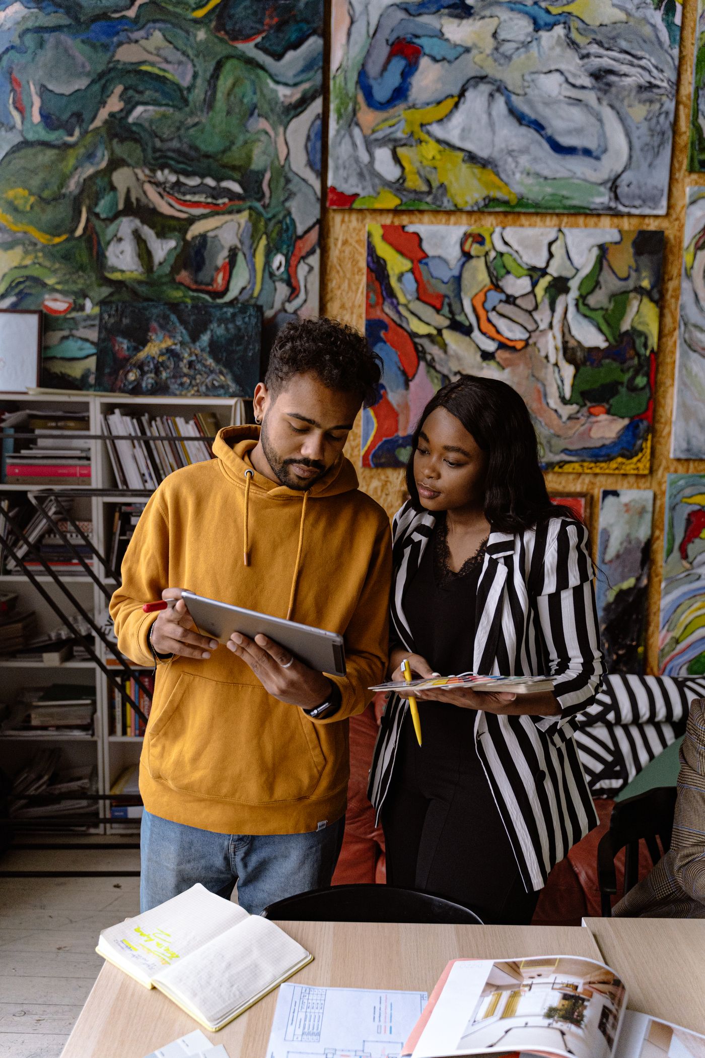 Designers collaborating in an art-filled creative office