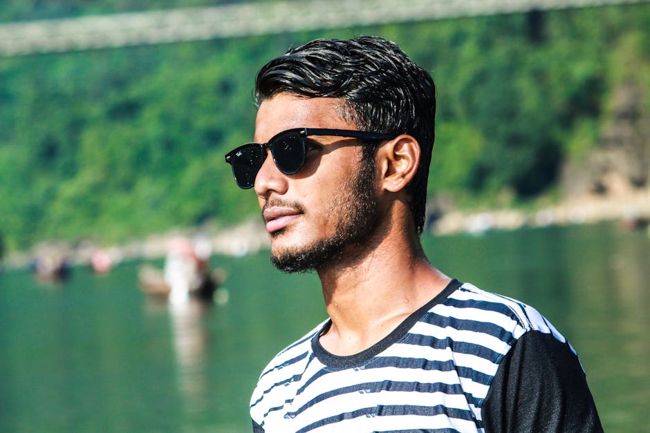 A young man with sunglasses by the river at Jaflong, Bangladesh.