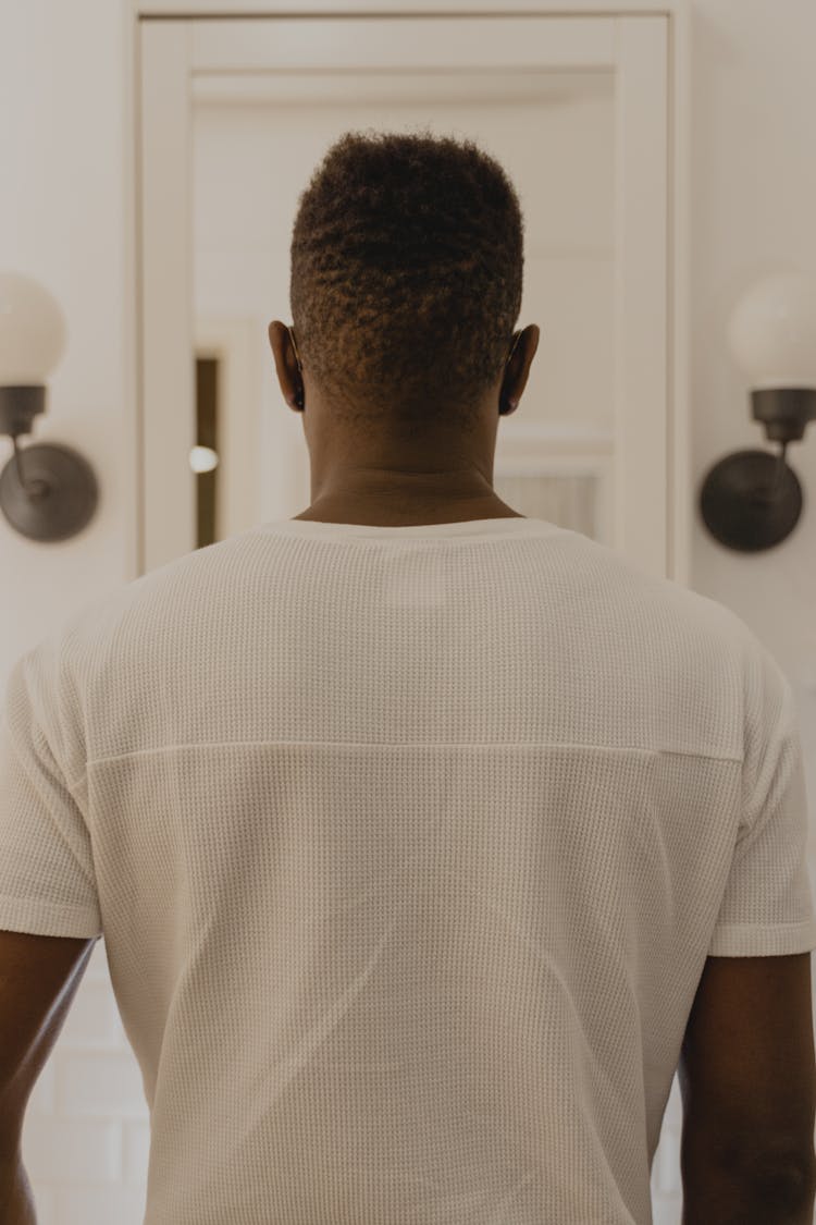 Back View Of A Person In A White Shirt