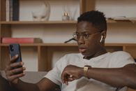 Man in White Crew Neck T-shirt Wearing Black Framed Eyeglasses