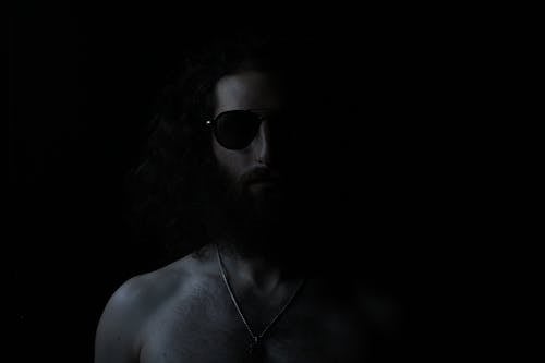 Grayscale Photography Of Topless Man Wearing Sunglasses