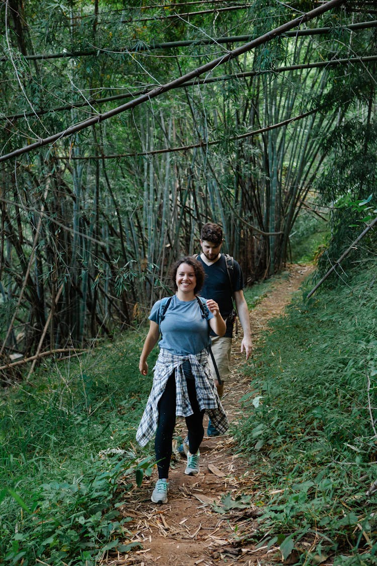 Content Young Couple Hiking In Tropical Rainforest During Summer Holidays