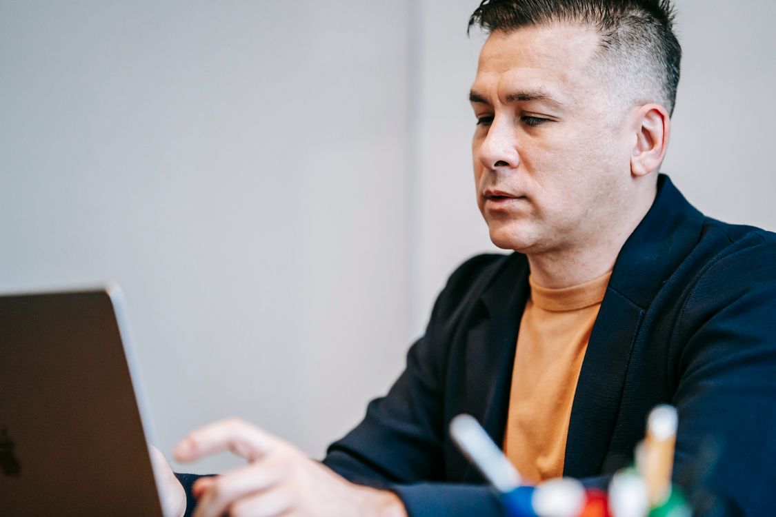 Close-Up Photo Of Man In Front Of His Laptop · Free Stock Photo