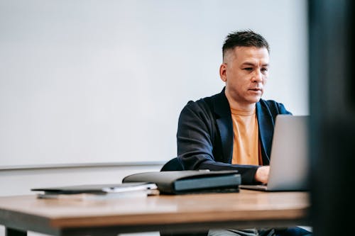 Free Photo Of Man Engaged In His Laptop Stock Photo