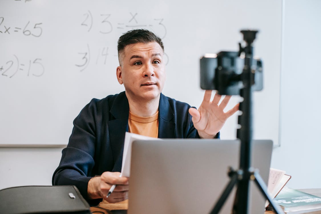 Free Photo Of Man Teaching Via Smartphone Stock Photo