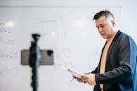 Photo Of Man Discussing Lessons