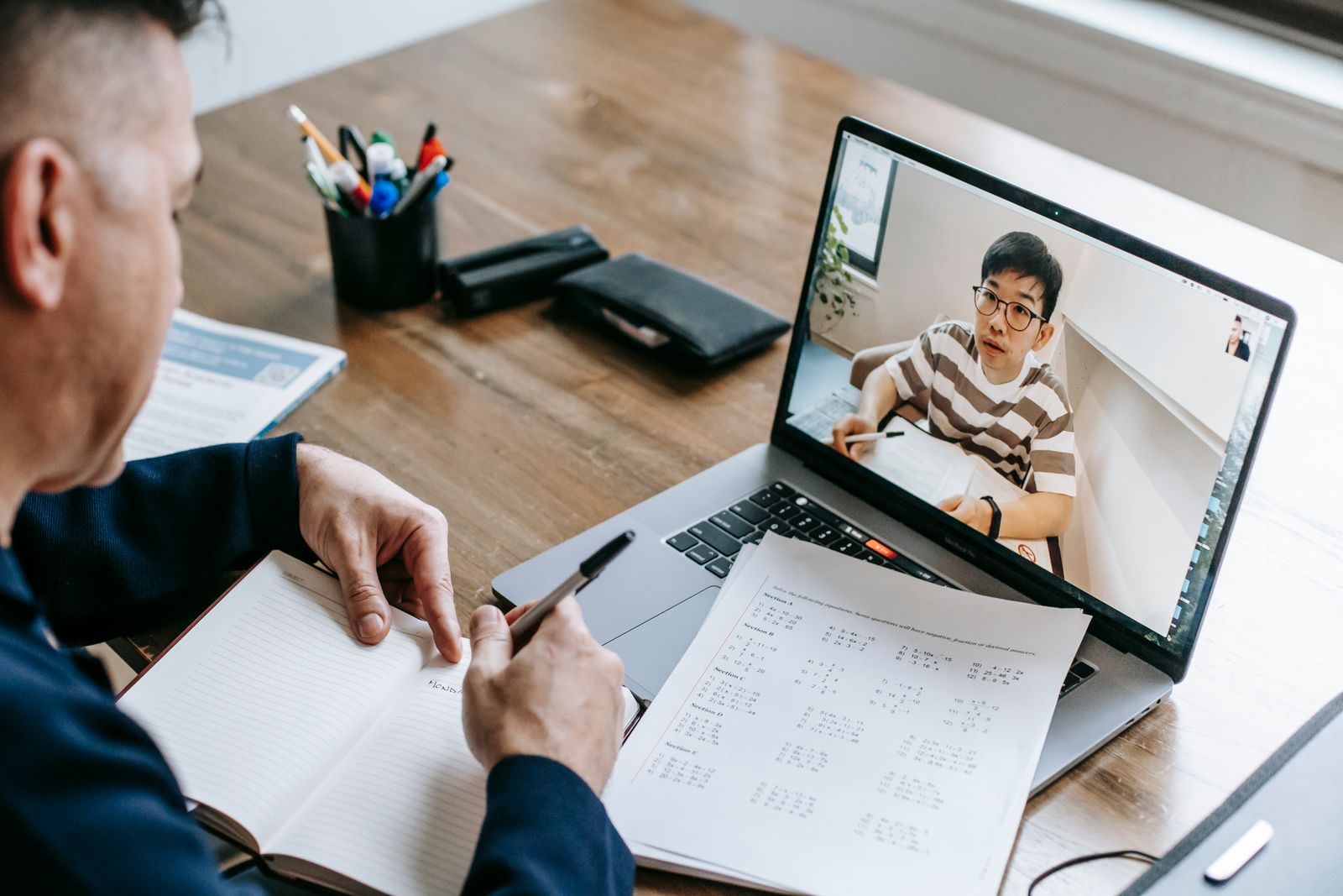 Adult learner participating in a live online 1-on-1 English lesson with a certified native teacher