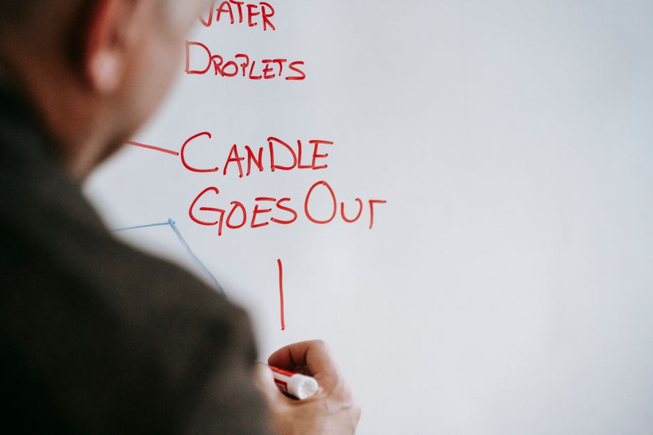 person pointing network diagram whiteboard
