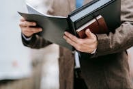 Photo Of Person reading On Notebook