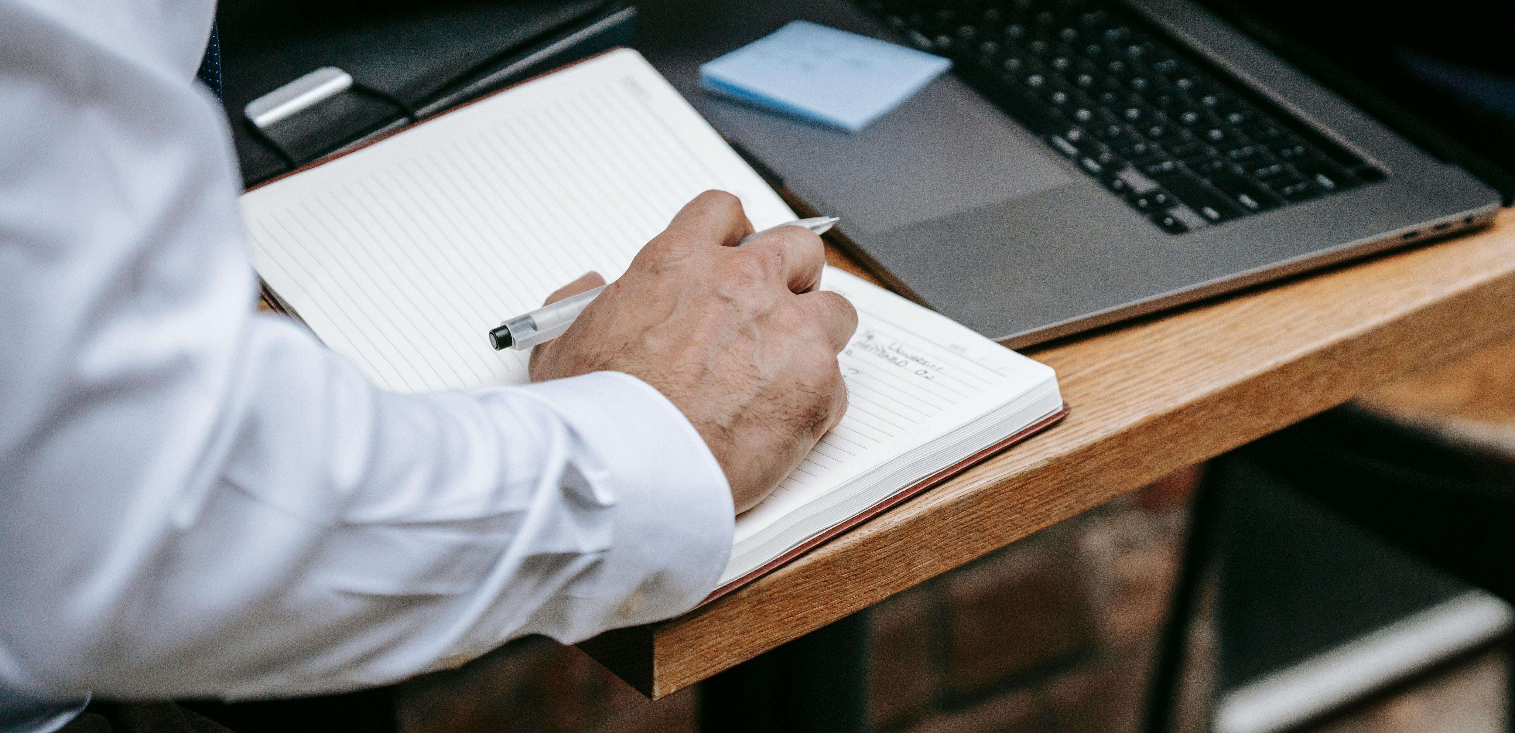 Person Preparing For A Meeting, Looking Anxious, With Notes And A Planner