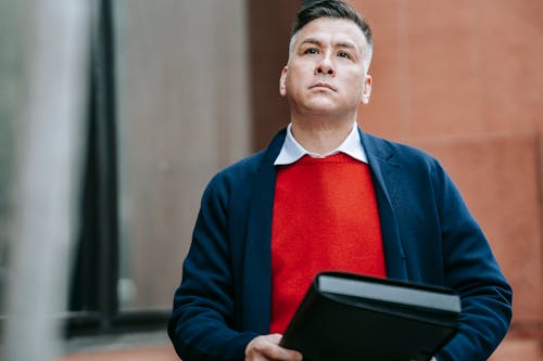 Photo Of Man Carrying Black Envelope