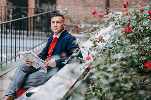 Photo Of Man Sitting Outdoors 