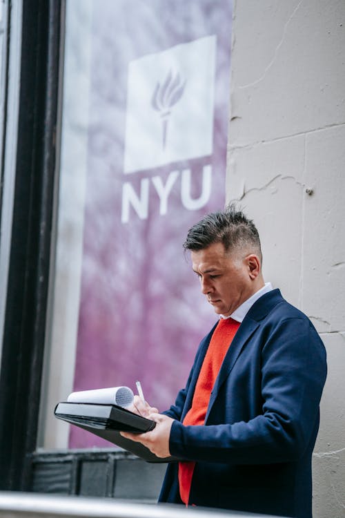 Photo Of Man Doing Paperwork 