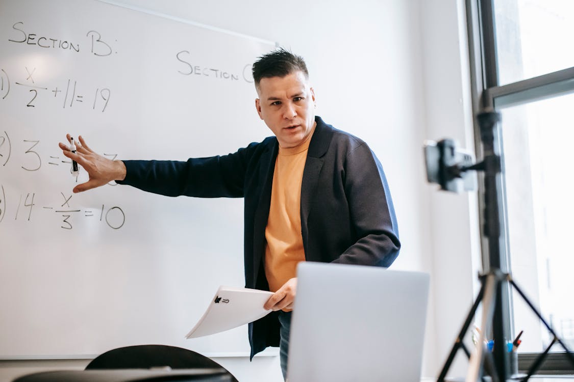 Free Photo Of Man Discussing Via Smartphone Stock Photo