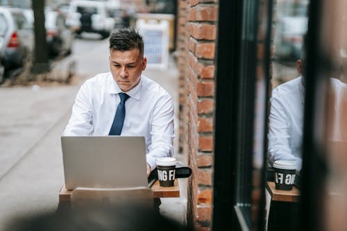 Photo Of Man Working On Laptop