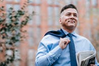 Close-Up Photo Of Man Wearing Blue Necktie