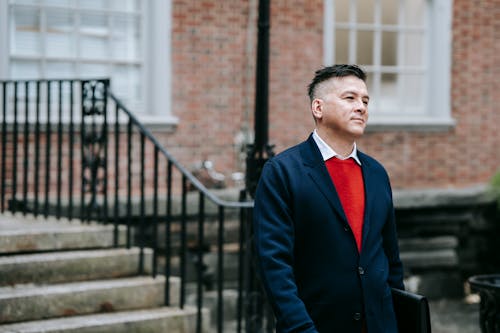 Photo Of Man Wearing Blue Coat 