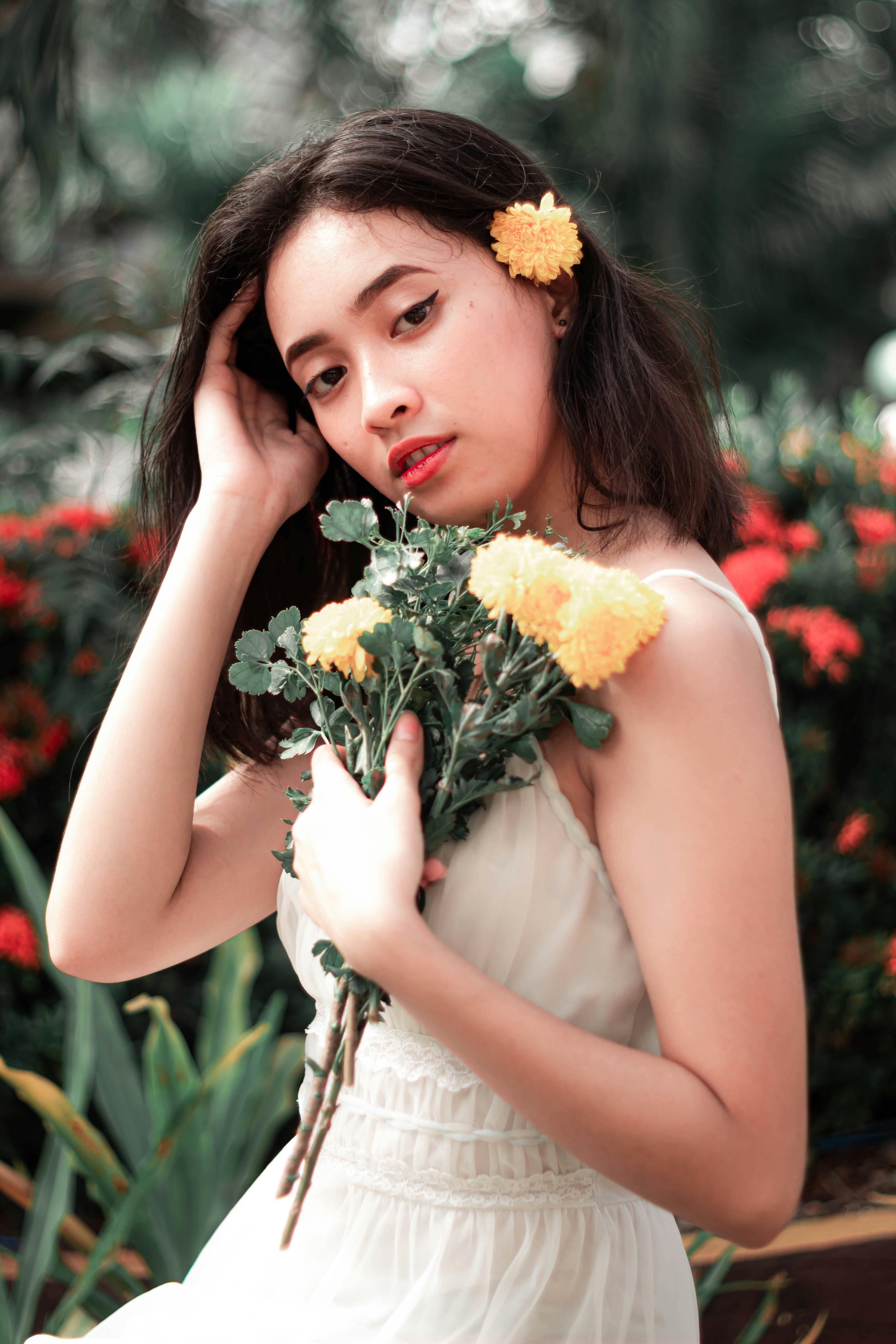Pretty Woman with Yellow Flower on Hair · Free Stock Photo
