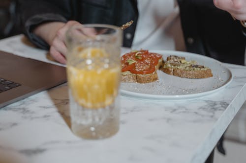 Free Person Eating Wheat Bread With Tomatoes  Stock Photo