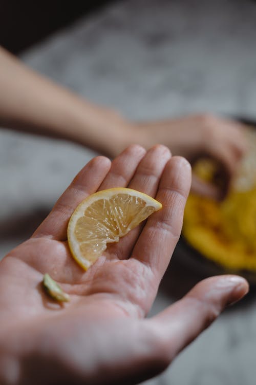 Gratuit Photos gratuites de citron, doigts, en tranches Photos