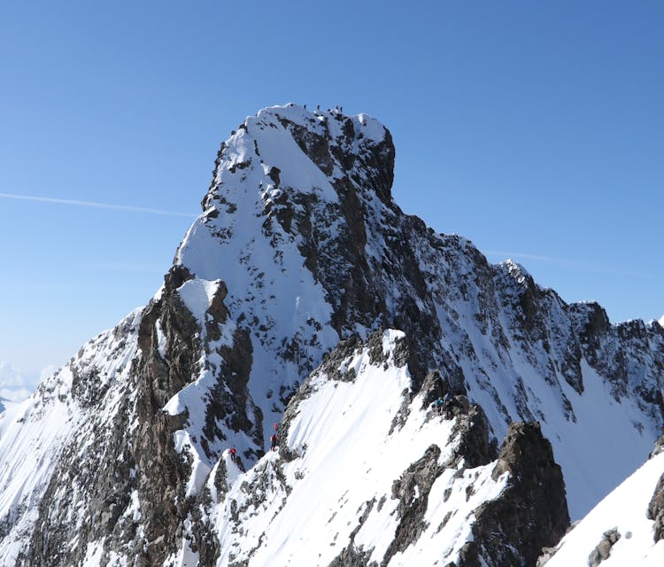 Sunlight On A Snowcapped Mountaintop