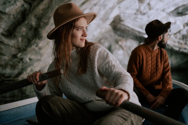 Couple On Boat In Cave