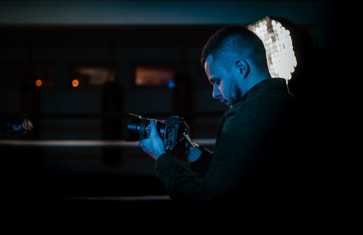 Photographer With Photo Camera In Ring Of Gym