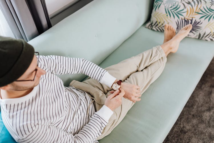 A Man Winding His Wristwatch