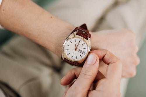 Free Person Adjusting His Watch Stock Photo