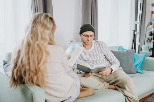 Man and Woman Reading Books Together