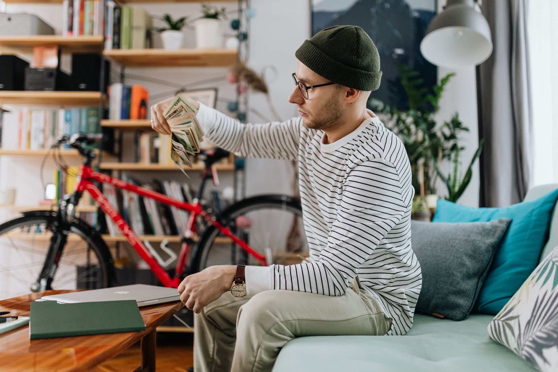 Automate Payment Reminders: Get Paid On Time 5 Freelancer looking thoughtfully at a financial projection chart