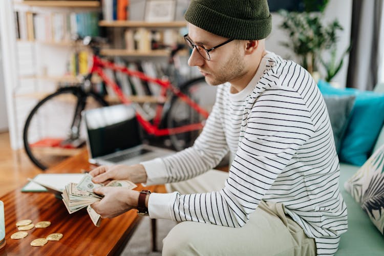 A Man Counting His Money