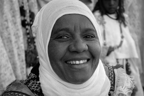 A Grayscale Photo of a Woman Wearing Hijab