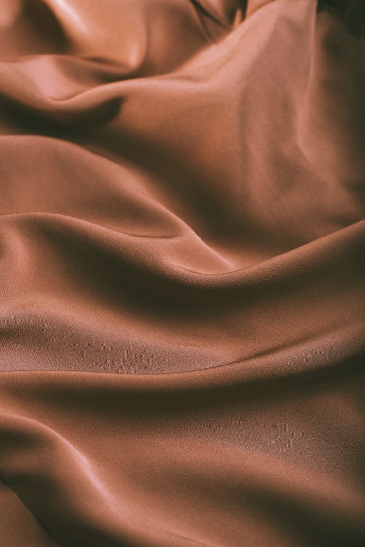 Background Of Smooth Rippled Brown Silk Fabric