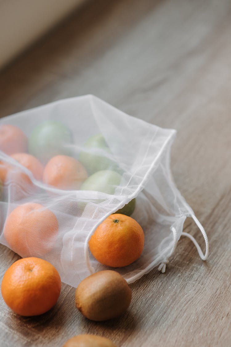 Fresh Fruit In White Bag On Windowsill