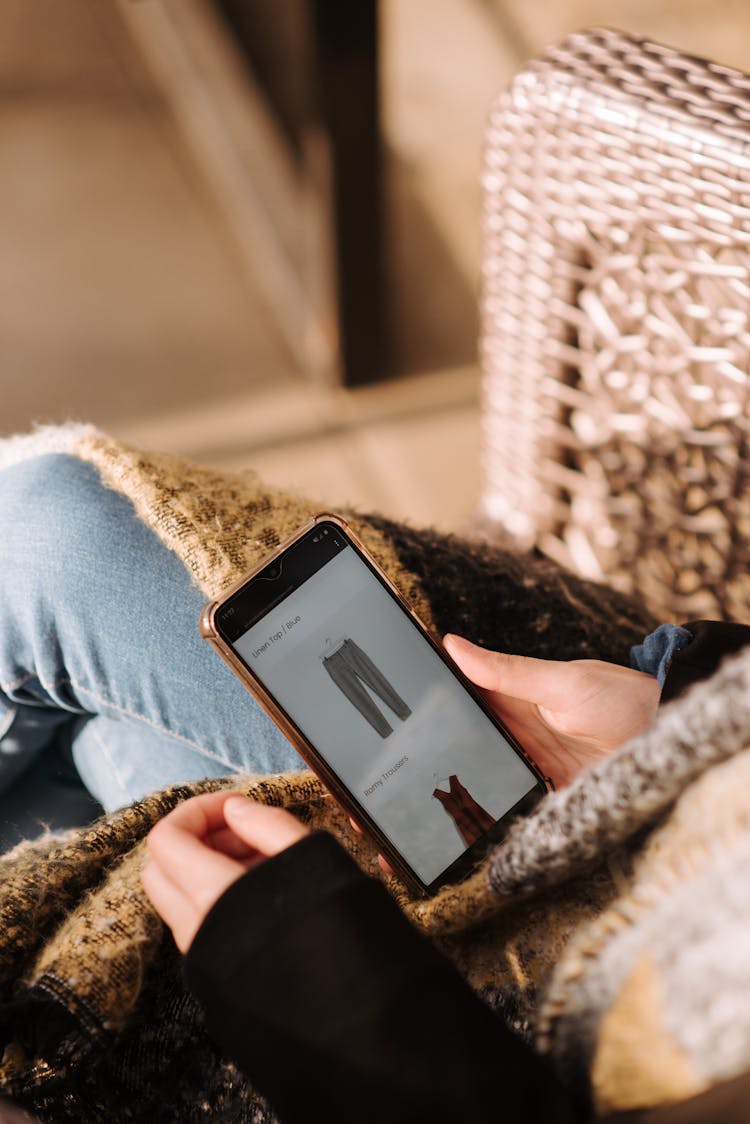 Woman Using Smartphone For Online Shopping